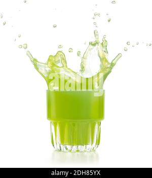 green juice exploding out of a glass isolated on white Stock Photo
