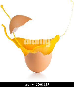 yolk splashing out of a broken egg isolated on white Stock Photo