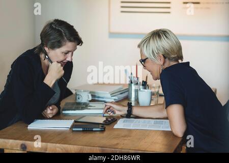 Product designers using digital tablet at home office Stock Photo