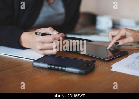 Cropped image product designers using digital tablet at home office Stock Photo