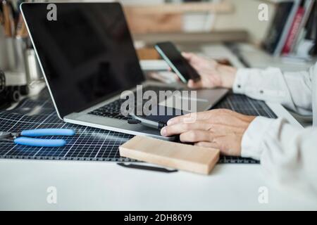 Cropped image of industrial designer making solar product at home office Stock Photo