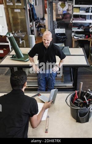 Young male high school student with teacher in training class Stock Photo