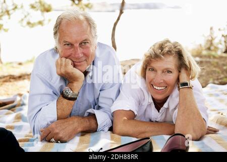Close up portrait of smiling couple at picnic Stock Photo