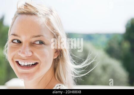 Close up of beautiful young woman looking away through sideway glance Stock Photo
