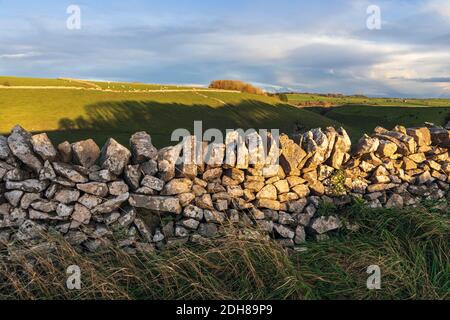 Late afternoon autumn sunshine on fields near Ballidon, Peak District National Park, Derbyshire Stock Photo