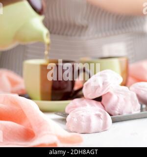 Russian Strawberries with cream marshmallows and tea on a bright table. still life, selective focus. 1: 1 Stock Photo