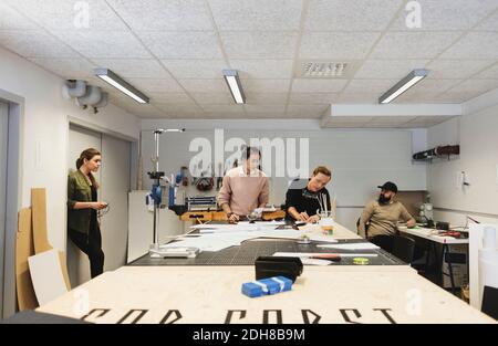 Engineers working on table in creative office Stock Photo