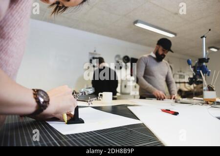Engineers working on project in workshop Stock Photo