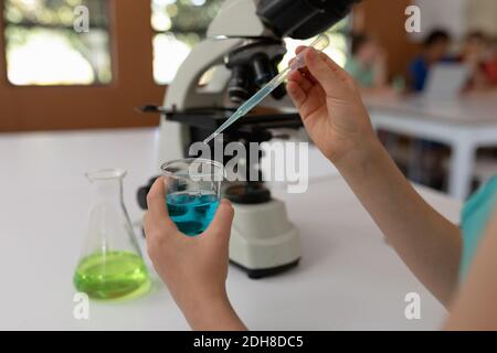 Elementary school girl in chemistry class Stock Photo