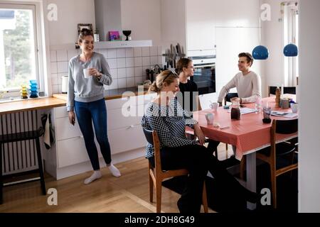 Happy family spending leisure time in kitchen of new home Stock Photo