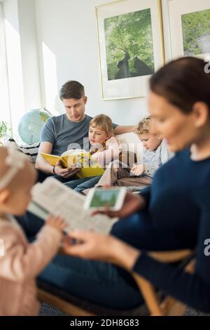 A family in the living room Stock Photo - Alamy