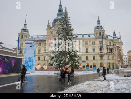 Graz, Austria - December 03, 2020: Beautiful Christmas tree and Town Hall building at famous main square Hauptplatz , in winter, in the city center of Stock Photo