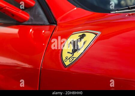 Close up detail of the emblem logo badge on the side of a red rosso corsa Ferrari F430 sports coupe Stock Photo