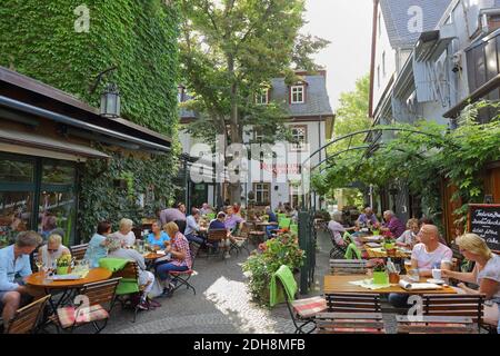 Rudesheimer Schloss restaurant in old Drosselgasse street in winegrowing town of Rüdesheim am Rhein, Hesse, Germany Stock Photo