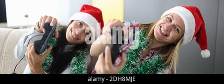 Woman hold joystick in hand and lean to side. Stock Photo