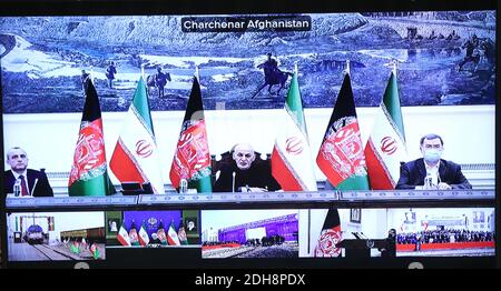 Tehran, Iran. 10th Dec, 2020. A handout photo made available by the official website of the Iranian presidential office of a screen showing the inaugurate ceremony of the Herat-Khaf railway operations linking Iran and Afghanistan, in Tehran, Iran, 10 December 2020. The Herat-Khaf railway, officially opened on 10 December, is 130kms long track connecting Iran's eastern city of Khaf to Afghanistan's western Herat province, providing a crucial transport link for the landlocked Afghanistan. Credit: Iranian Presidency/ZUMA Wire/Alamy Live News Stock Photo