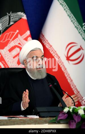 Tehran, Iran. 10th Dec, 2020. A handout photo made available by the official website of the Iranian presidential office shows Iranian President Hassan Rouhani attending via a video link the inauguration of the Herat-Khaf railway operations linking Iran and Afghanistan, in Tehran, Iran, 10 December 2020. The Herat-Khaf railway, officially opened on 10 December, is 130kms long track connecting Iran's eastern city of Khaf to Afghanistan's western Herat province, providing a crucial transport link for the landlocked Afghanistan. Credit: Iranian Presidency/ZUMA Wire/Alamy Live News Stock Photo