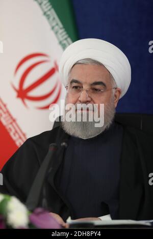 Tehran, Iran. 10th Dec, 2020. A handout photo made available by the official website of the Iranian presidential office shows Iranian President Hassan Rouhani attending via a video link the inauguration of the Herat-Khaf railway operations linking Iran and Afghanistan, in Tehran, Iran, 10 December 2020. The Herat-Khaf railway, officially opened on 10 December, is 130kms long track connecting Iran's eastern city of Khaf to Afghanistan's western Herat province, providing a crucial transport link for the landlocked Afghanistan. Credit: Iranian Presidency/ZUMA Wire/Alamy Live News Stock Photo