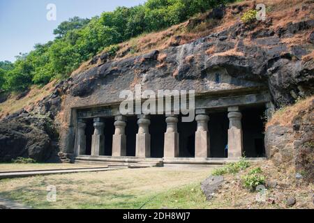 Mumbai, India: Exterior of Kanheri Caves entrance through pillars carved by cutting rock mountain located in the state of Maharashtra Stock Photo
