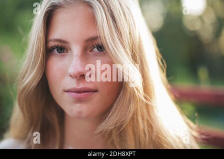 Close-up portrait of teenage girl in back yard Stock Photo