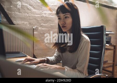Businesswoman working on computer at workplace Stock Photo