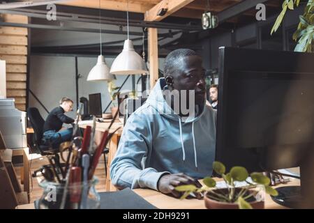 Businessman working on computer at workplace Stock Photo