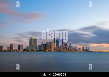Miami, Florida, USA downtown city skyline on Biscayne Bay at twilight.