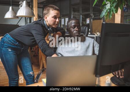 Computer programmers working on computer at workplace Stock Photo