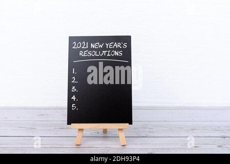 2021 New Year's Resolutions on black board with copy space Stock Photo