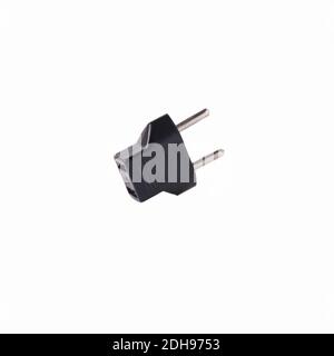 2-pin EU to US plug type Converter black Plastic element isolated on a white background Stock Photo