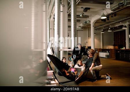 Businessmen and businesswomen working in office Stock Photo