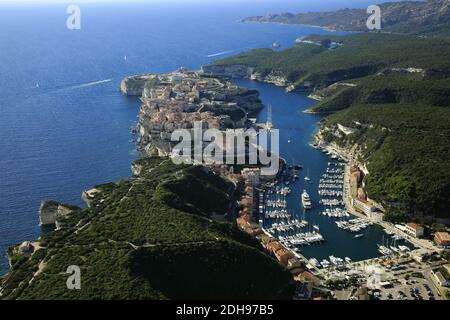 Corse-du-Sud (Southern Corsica): aerial view of the upper town of Bonifacio, its citadel, its commercial port and marina surrounded by cliffs Stock Photo