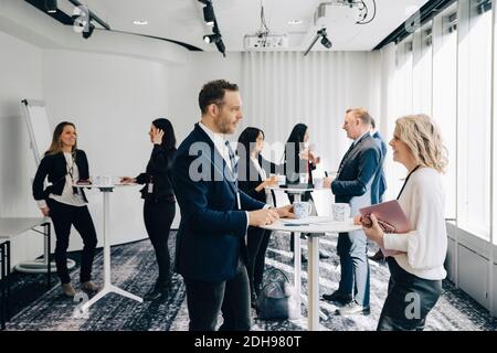 Business professionals discussing at workplace Stock Photo
