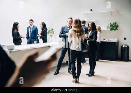 Entrepreneurs discussing at office seminar Stock Photo