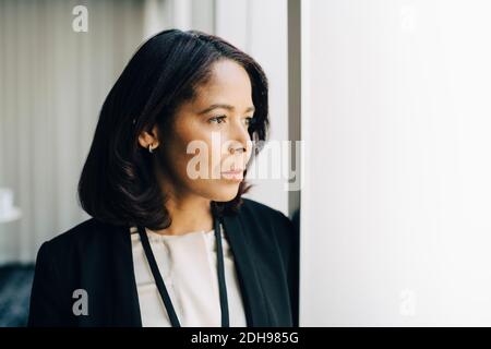 Close-up of businesswoman looking away at workplace Stock Photo