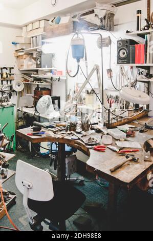 Various work tools on workbench in jewelry workshop Stock Photo