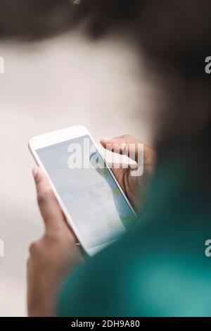 Cropped image of businesswoman using smart phone Stock Photo