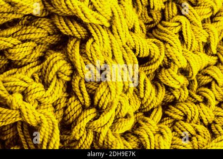 A Classic Blue knitted blanket background in a cozy style. Flat lay. Stock Photo