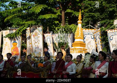 Unidentified people of traditional Buddhist parade while performing on the street, in Participants take part in the celebration of International silk. Stock Photo