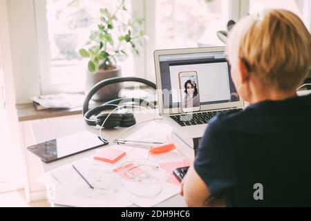 Women workin in office at home having an online meeting Stock Photo