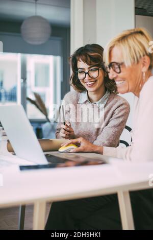 Two businesswomen having fun working together at home Stock Photo