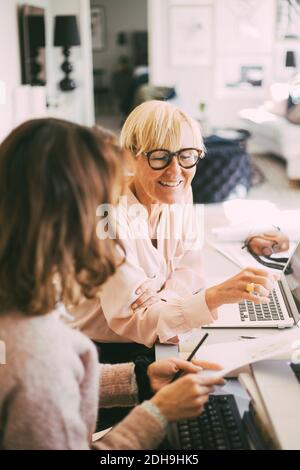 Female coworkers working from home Stock Photo