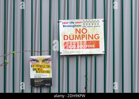 No dumping or fly tipping sign amongst derelict factories and fly tipped rubbish in Abberley Street in Cape Hill, Smethwick, West Midlands, UK Stock Photo