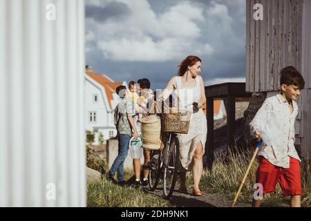 Family walking towards archipelago during summer holiday Stock Photo
