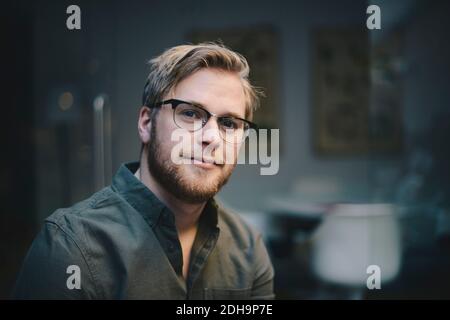Portrait of confident male computer programmer in office Stock Photo