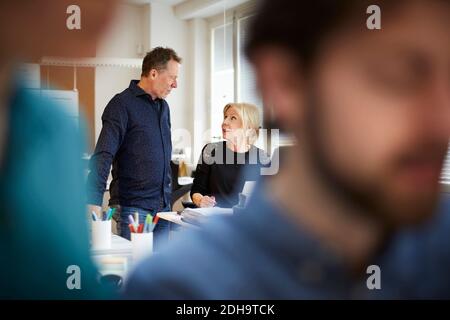 Business colleagues talking at creative office Stock Photo