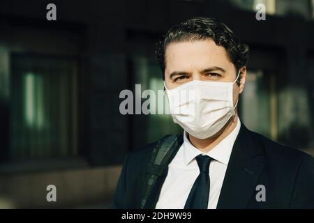Portrait of businessman with face mask Stock Photo