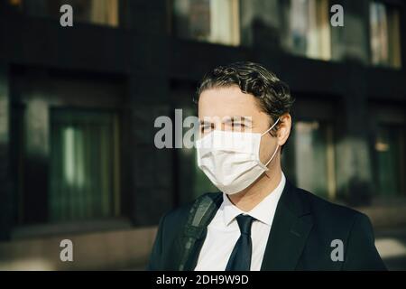 Businessman with face mask Stock Photo