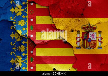 Flags of Valencian Community and Spain painted on cracked wall Stock Photo