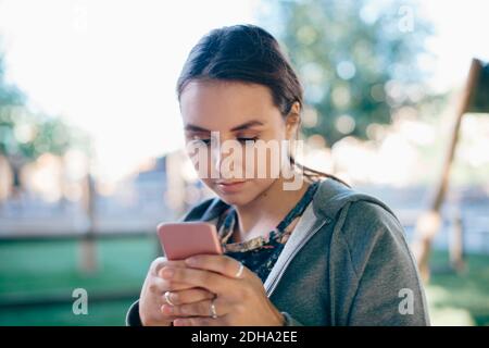 Young woman using smart phone Stock Photo
